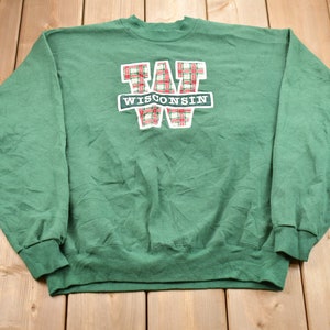 May include: Green sweatshirt with a red and white plaid "W" and the word "WISCONSIN" in white lettering.