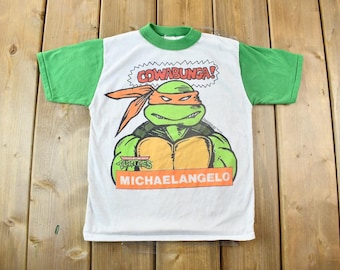 Vintage 1990 Teenage Mutant Ninja Turtles Cowabunga Michaelangelo Graphic Child Size T-Shirt / Made In USA / Baby Tee / Single Stitch