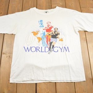 Vintage 1980s World Gym Running Man Ringer T Shirt / 80s Tee / Streetwear Fashion / Made In USA / SSI