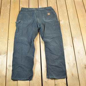 Vintage 1990s Black Carhartt Denim Work Jeans Size 38 x 32 / 90s Carpenter Pants / Made In USA / Distressed Carhartt / Vintage