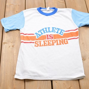 Vintage 1980s Boys Athlete Graphic Ringer T-Shirt / Graphic / 80s / 90s / Streetwear / Retro Style / Single Stitch / Made In USA