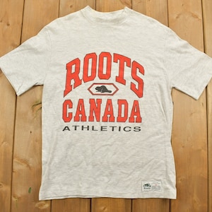 Camiseta gráfica vintage de los 90 con raíces canadienses / Años 90 / Atletismo / Ropa urbana / Camiseta gráfica / Costura sencilla / Hecha en Canadá