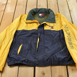 Vintage 1990s Tommy Hilfiger Flag Patch Color Block Windbreaker Jacket Men's 2XL / Sleeve Spellout / Packable Hood / Streetwear