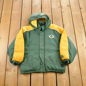 May include: Green and yellow hooded jacket with a Green Bay Packers logo on the front.