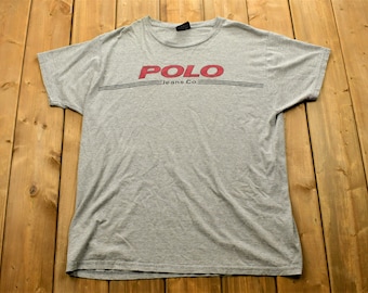 Camiseta vintage de los 90 de Polo Jeans Ralph Lauren con estampado gráfico, talla XL para hombre, años 90, estilo urbano, ropa deportiva vintage, marca y logotipo.