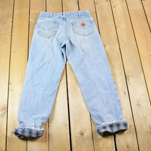 Vintage 1990s Carhartt Denim Lined Work Jeans Size 34 x 34 / 90s Carpenter Pants / Made In USA / Distressed Carhartt / Vintage Workwear
