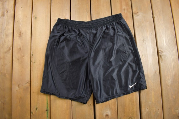 Vintage 1990s Nike Mini Swoosh Swim Shorts Size X… - image 1