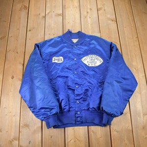 May include: Blue satin bomber jacket with "East End Chiefs 1970 Champs W.P.C." and "Sulley 10" patches.