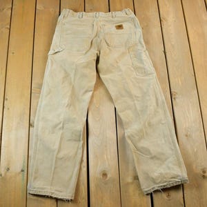 Vintage 1990s Tan Carhartt Denim Work Jeans Size 34 x 32 / 90s Carpenter Pants / Made In USA / Distressed Carhartt / Vintage Workwear