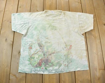 Maglietta vintage anni '90 con stampa tie-dye a punto singolo Rainforest Preserve Paradise, realizzata negli Stati Uniti.