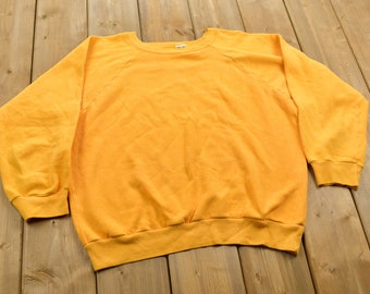 yellow sweat shirt