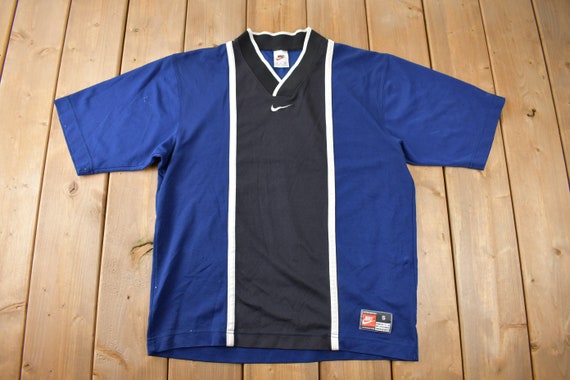 nike shirt with swoosh in middle