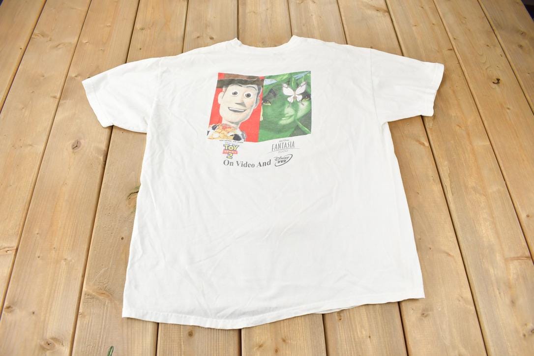 Vintage 2000 Toy Story 2 & Fantasia Disney Movie Promo Graphic T-Shirt / Day After Day Disney Deliveries