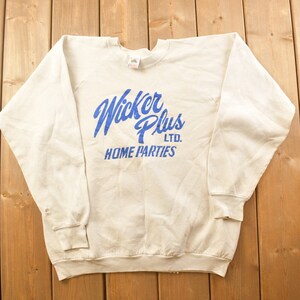 May include: A white sweatshirt with a blue logo that says "Wicker Plus LTD. HOME PARTIES".