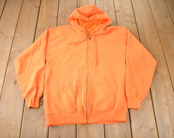 Vintage lege oranje hoodie met rits uit de jaren 80, gemaakt in de VS