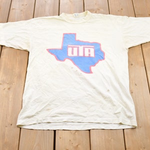 Vintage 1980s Champion UTA Graphic T-Shirt / Graphic / 80s / 90s / Streetwear / Retro Style / Single Stitch / Made In USA / University