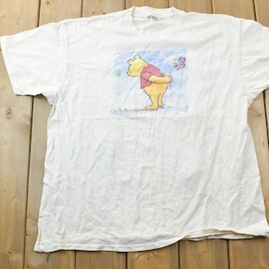 1990年代ヴィンテージ くまのプーさん 花を持ったディズニー漫画プロモーションTシャツ / 90年代グラフィックTシャツ / ヴィンテージミッキーマウス / アメリカ製