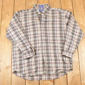May include: A long-sleeved, button-down shirt with a plaid pattern in grey, white, and burgundy. The shirt features a classic collar and buttoned cuffs. The shirt is made of a soft, woven fabric.