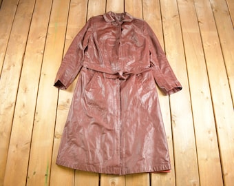 May include: A long brown leather coat with a belt and a button closure.