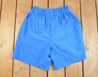 May include: A pair of blue shorts with an elastic waistband and side pockets.