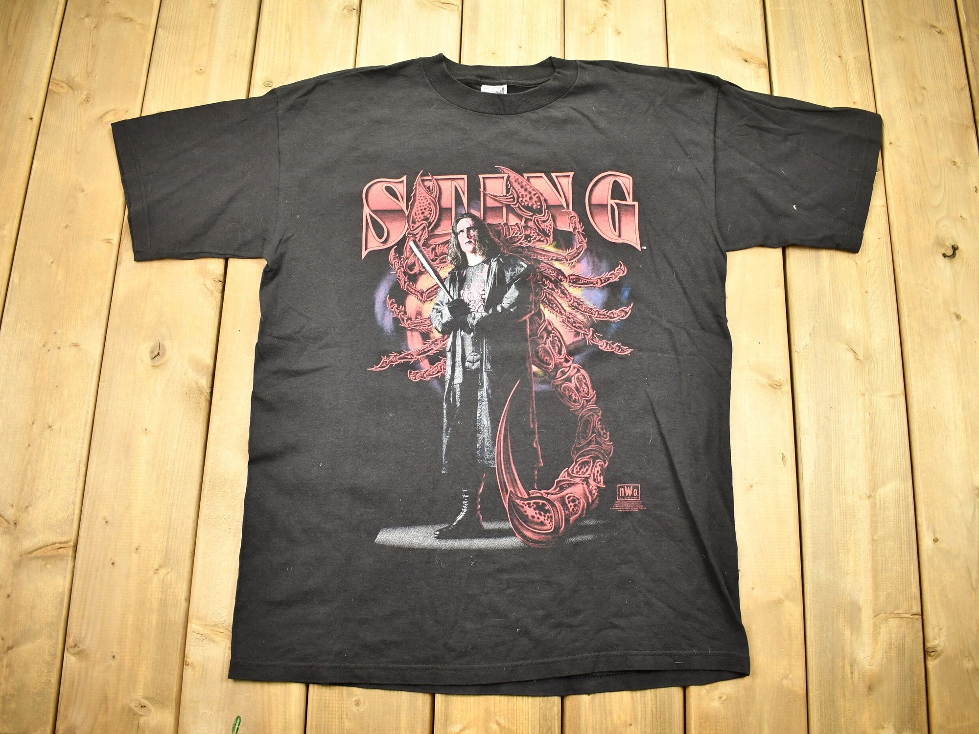 Discover Vintage 1998 WW NWO Sting Graphic Wrestling T-Shirt