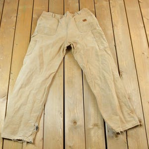 Vintage 1990s Carhartt Lined Tan Denim Work Jeans Size 38 / 90s Carpenter Pants / Made In USA / Distressed Carhartt / Vintage Workwear