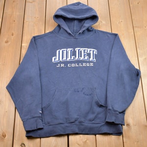 May include: A dark blue hooded sweatshirt with the text "Joliet Jr. College" in white lettering.