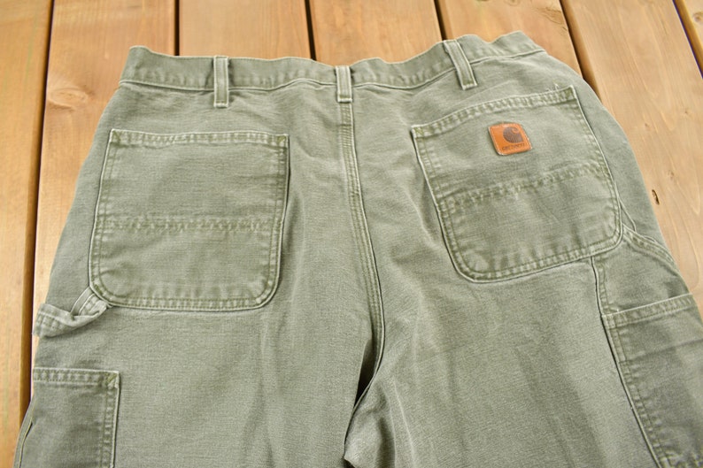 green carpenter trousers