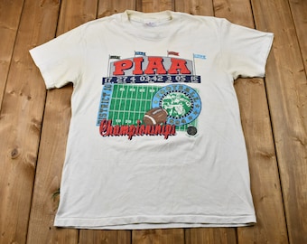 Vintage 1994 Discolored Pennsylvania Interscholastic Athletic Association Championships T-Shirt Men's M / Sportswear / Athleisure / Football