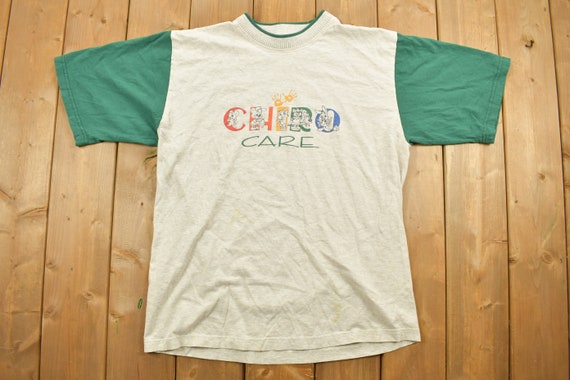 Vintage 1990s Chiro Care Graphic T-Shirt / Childc… - image 1