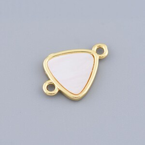 May include: Gold-toned triangle connector with a white mother-of-pearl inlay. The connector has two jump rings for attaching jewelry.