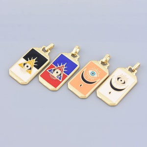 May include: Four gold-tone pendants with different colored enamel designs featuring an eye motif. The pendants are rectangular with a gold-tone chain loop at the top.