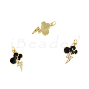 May include: Three gold-tone charms featuring a black enamel cloud with a lightning bolt. The lightning bolt is accented with clear rhinestones.