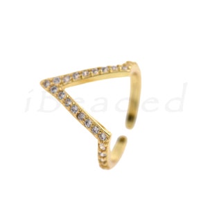 May include: Gold-toned ring with a clear crystal-encrusted triangle design.