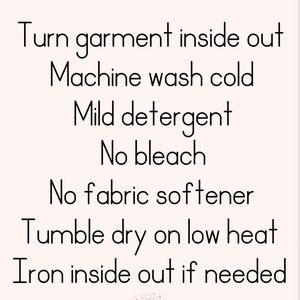 May include: Care instructions for a garment: Turn garment inside out, machine wash cold, mild detergent, no bleach, no fabric softener, tumble dry on low heat, iron inside out if needed.  The text "One Inspired Mom" is at the bottom of the image.