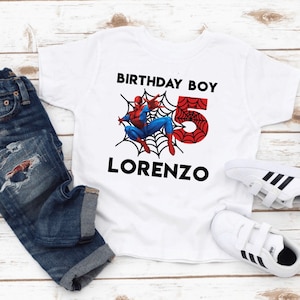 May include: White t-shirt with a red and blue Spiderman graphic, a red number 5, and the text "Birthday Boy" and "Lorenzo".