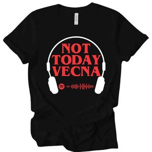 May include: Black t-shirt with the red text "NOT TODAY VECNA" in a stylized font. The design includes a white outline of headphones and a Spotify logo with a soundwave graphic. The shirt is made of a soft material.