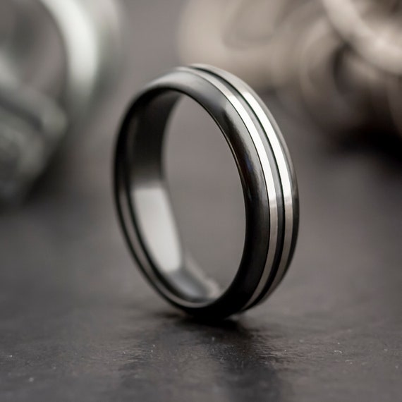 FACETED BLACK ZIRCONIUM RING WITH A TEXTURED FINISH | Black zirconium ring,  Mens wedding rings, Wedding rings unique