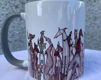 May include: A white ceramic mug with a gray handle features a whimsical illustration of a group of dogs in various poses and colors. The dogs are all stylized and have a cartoonish appearance.