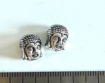Tibetan Buddha double sided head bead. top drilled silver colored set of 15  measures 10mm high x 8mm wide. New old stock
