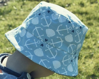 Anclas reversibles y conchas marinas sombrero de cubo