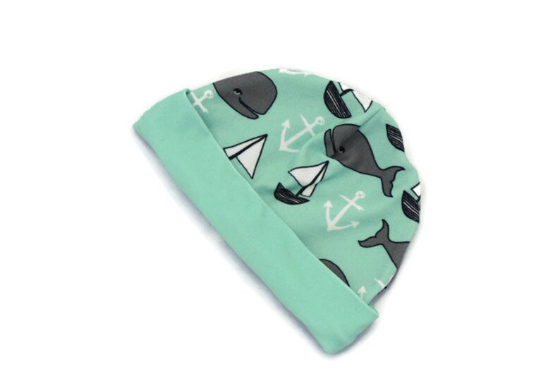 Turquoise whale unisex baby beanie hat with whale and boat design
