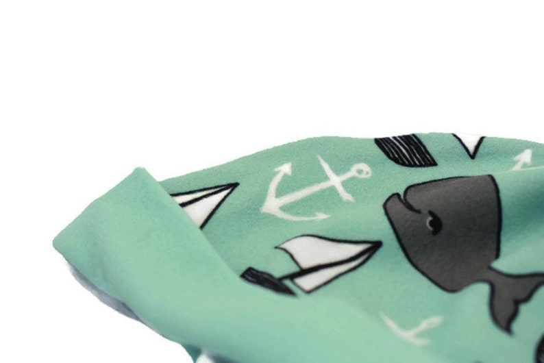 Turquoise whale unisex baby beanie hat with whale and boat design