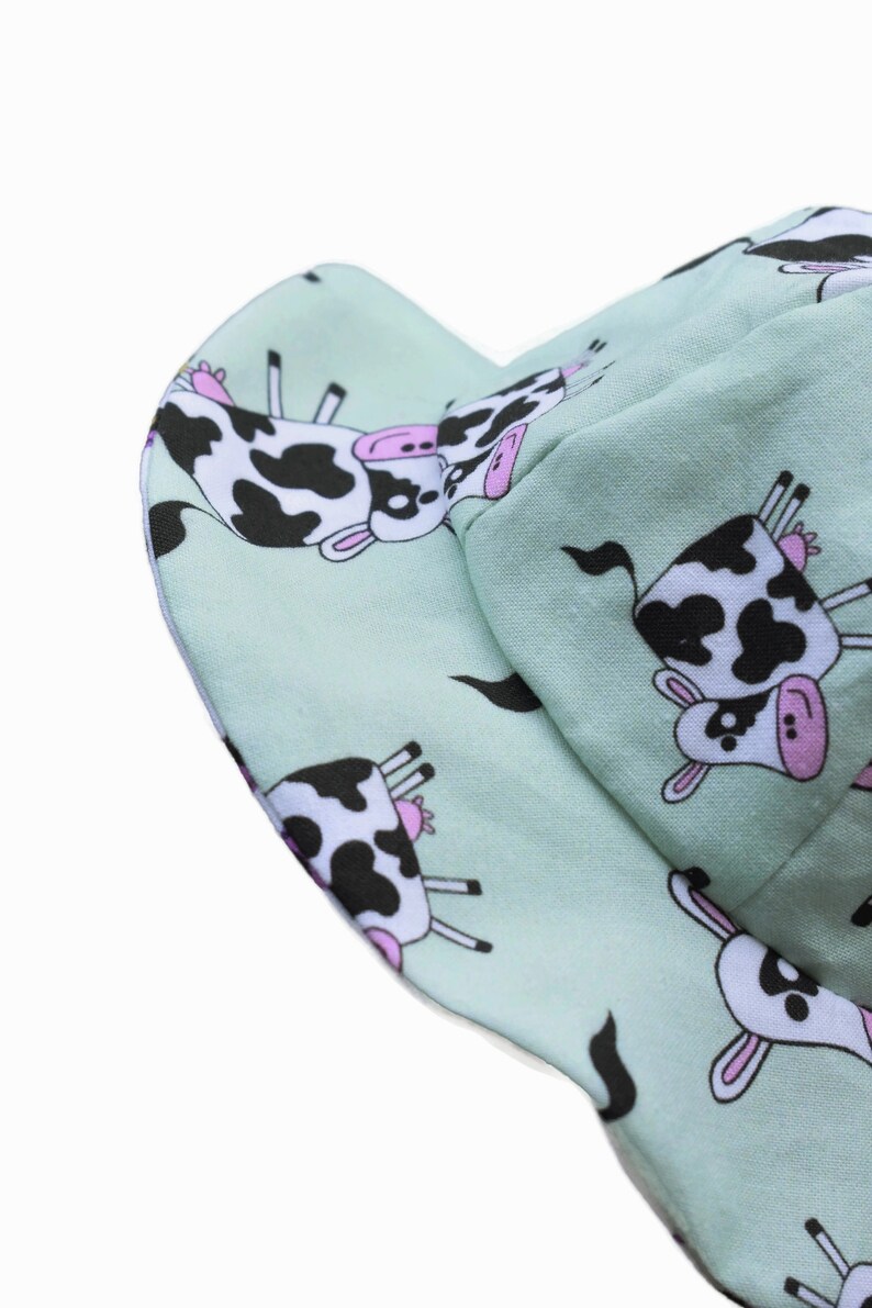Handmade reversible cotton Sun hat with pink tractors and cows