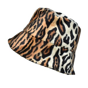 May include: A brown, black, and white bucket hat with a leopard print pattern.