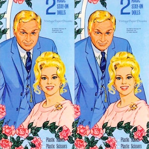 May include: A vintage Green Acres paper doll set featuring two dolls, a man and a woman, with a blue background and pink roses. The box features the text "Green Acres" in green letters and "Magic Stay-On Dolls" in black letters. The box also includes the text "Vintage Paper Dreams" and "1968 by Filmways TV Productions, Inc. All rights reserved."