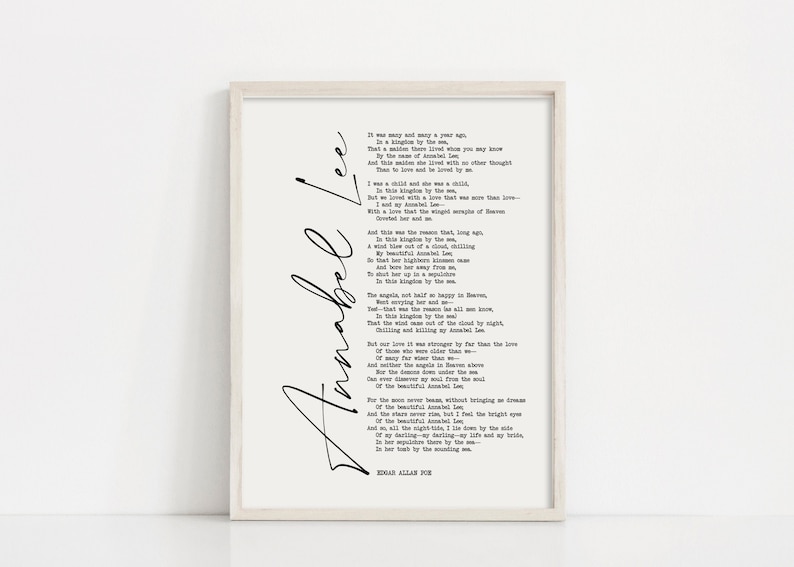 May include: A black and white printable wall art print featuring a poem titled "Annabel Lee" by Edgar Allan Poe. The poem is written in a classic font and the name "Annabel Lee" is written in a cursive script.
