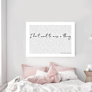 May include: A black and white printable wall art print with a quote that reads "I don't want to miss a thing". The quote is in a cursive font and is surrounded by a block of text in a serif font.
