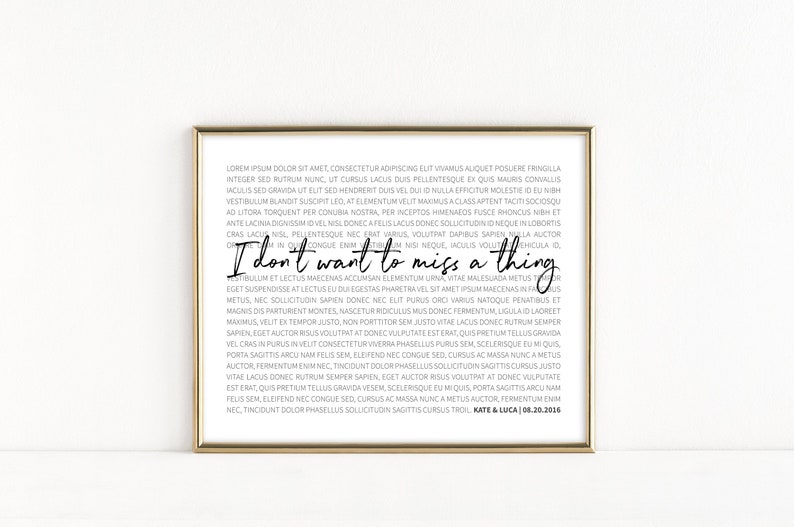 May include: A gold-framed print with a white background and black text. The text reads "I don't want to miss a thing."  The text is a quote from the song "I Don't Want to Miss a Thing" by Aerosmith. The print also includes the names "Kate & Luca" and the date "08.20.2016".