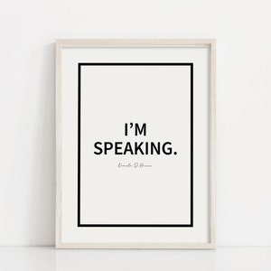 May include: A white framed print with a black border and the text "I'M SPEAKING." in black font. The text "Kamala D. Harris" is written in a smaller font below the main text.